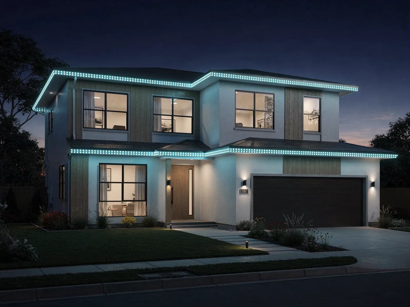 A modern two-story home at night with permanent color LED trim lighting glowing in an even row of crisp blue and teal dots along every roofline and eave.