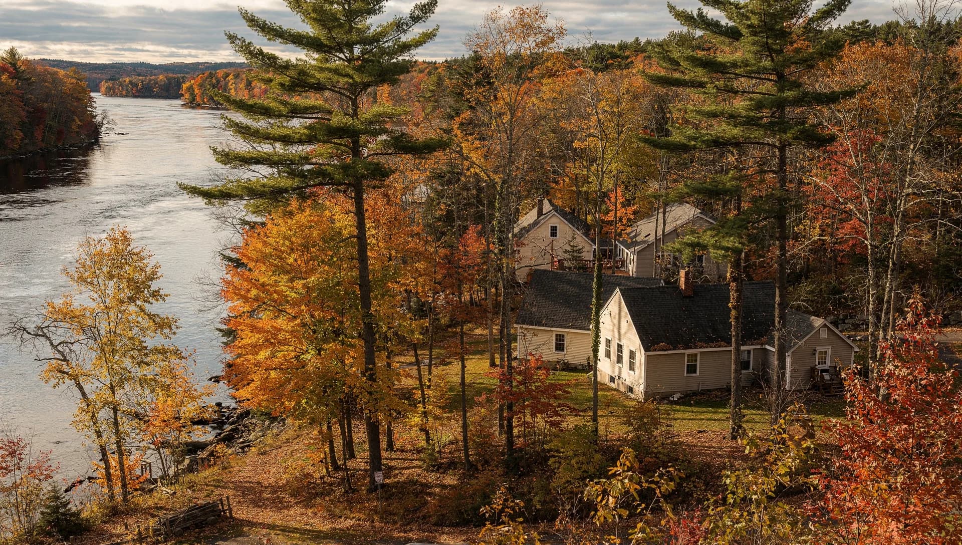 A newer family home on a rural lot along a bend of the Merrimack River in Bow, New Hampshire.