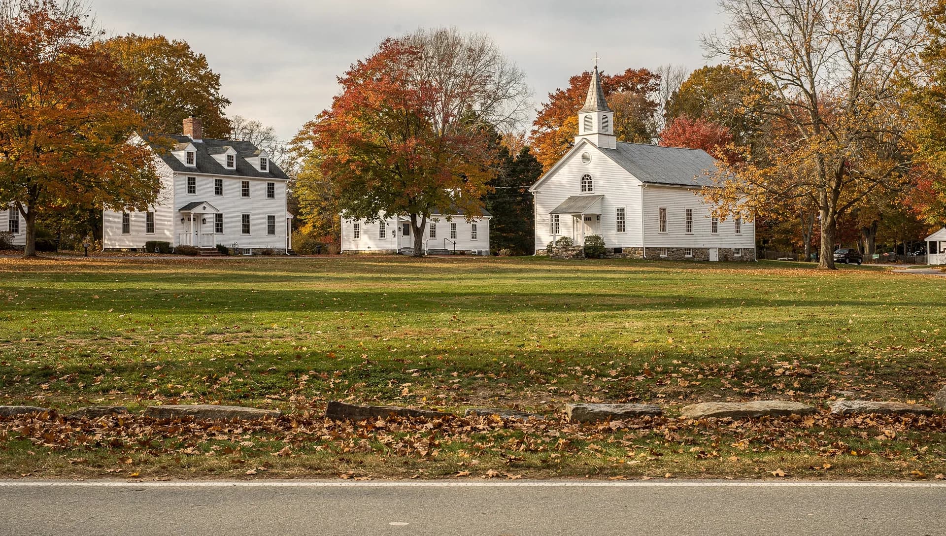 A historic New England town-center home along a quiet road in North Andover, Massachusetts.